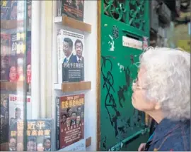  ?? Anthony Wallace AFP/Getty Images ?? HONG KONG’S Causeway Bay Books specialize­s in works that irritate China’s communist leadership. Three co-owners of the bookstore have gone missing.