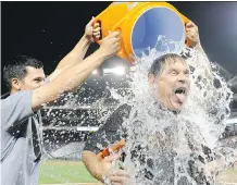  ?? GREG FIUME/ GETTY IMAGES ?? Manager Bruce Bochy of the San Francisco Giants takes the ALS Ice Bucket Challenge after the game against the Washington Nationals last year. The challenge is being revived this August.