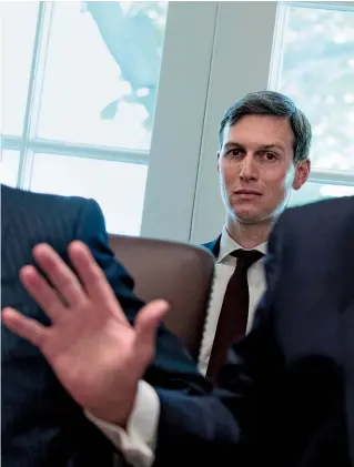  ??  ?? SHOWERED WITH SUSPICION: The Russia probe continues to dog Trump and his son-in-law, Kushner, despite (or perhaps because of) the president’s attempts to put it behind them.