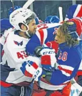  ?? GETTY ?? Caps’ Tom Wilson pulls Rangers’ Artemi Panarin to ice by his hair and that’s not even his biggest offense in Monday’s game at the Garden.