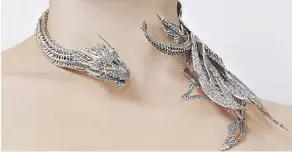  ??  ?? A replica of Daenerys’s Drogon Neck Sculpture can be bought online (mey.london). This piece of fine jewelry retails for about $3,000.