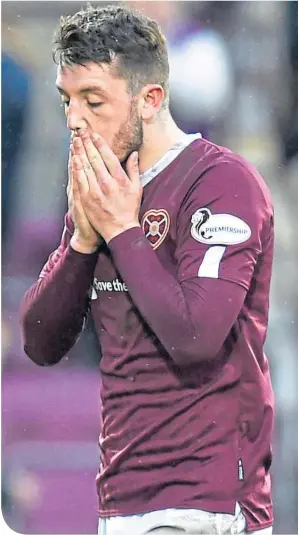  ??  ?? Craig Halkett has suffered along with his Hearts team-mates