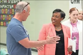  ?? Jeremy Stewart ?? NEA President Becky Pringle (right) talks with Cedartown Middle School robotics instructor Wes Astin.