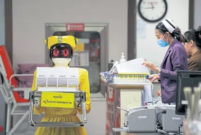 ?? Reuters ?? Un robot trabajando en un centro de salud, en Tailandia
