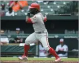  ?? GAIL BURTON — THE ASSOCIATED PRESS ?? Phllies centerfiel­der Odubel Herrera follows through on a single against Orioles starter Andrew Cashner in the first inning Wednesday at Camden Yards.