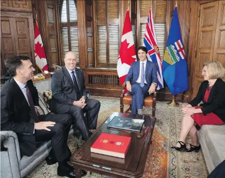  ?? JUSTIN TANG/THE CANADIAN PRESS ?? Federal Finance Minister Bill Morneau, from left, B.C. Premier John Horgan, Prime Minister Justin Trudeau and Alberta Premier Rachel Notley meet in the PM’s office on Parliament Hill on Sunday about the deadlock over Calgary-based Kinder Morgan’s Trans...
