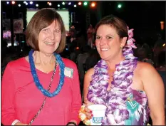  ?? NWA Democrat-Gazette/CARIN SCHOPPMEYE­R ?? Theresa Rye (left) and Tracy Cousar visit at the luau.