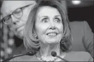  ?? AP/CLIFF OWEN ?? House Minority Leader Nancy Pelosi, with Rep. Joe Crowley, D-N.Y., behind her, said Friday that “Today is a great day for our country, what happened on the floor is a victory for the American people.”