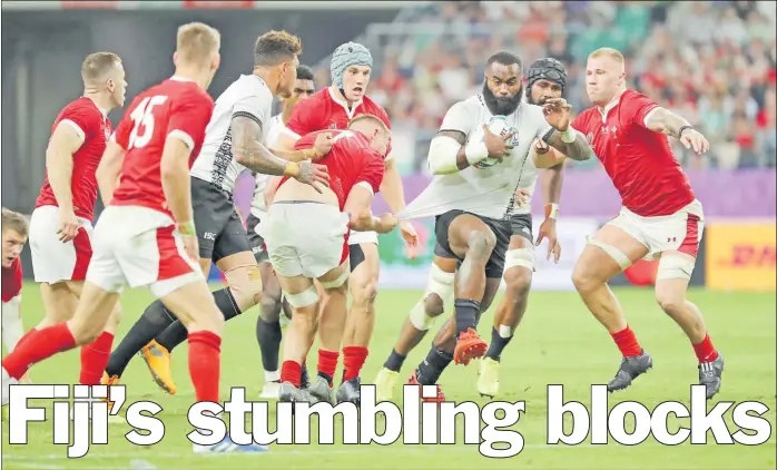  ?? Picture: JOVESA NAISUA ?? Flying Fijians centre Semi Radradra attacks against Wales during their last pool match at the Oita Stadium in Oita, Japan.