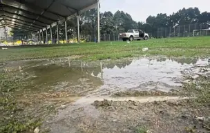  ?? ?? Weigh the risks, please: one of the water-logged football fields that will be used as a polling station in the Lembah Pantai parliament­ary constituen­cy.