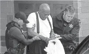  ?? JACQUELINE LARMA/AP ?? Bill Cosby is escorted out of the Montgomery County Correction­al Facility after being sentenced to a three-to-10-year prison sentence for sexual assault.