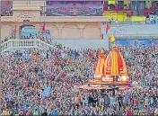  ??  ?? Devotees gather for an evening prayer on the banks of Ganga during Kumbh Mela in Haridwar.