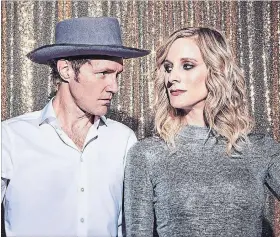  ?? JEN SQUIRES THE CANADIAN PRESS ?? Luke Doucet and Melissa McClelland of the band "Whitehorse" offered up a dark spin on the season with “A Whitehorse Winter Classic.”