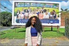  ?? SUBMITTED IMAGE ?? Trenton Central High School graduate Faith Iloka, an incoming Princeton University freshman, in front of a “Heal the City” billboard on East State Street near P.J. Hill School on Sunday, July 16, 2017. The billboard showcases TCHS students, like Iloka,...