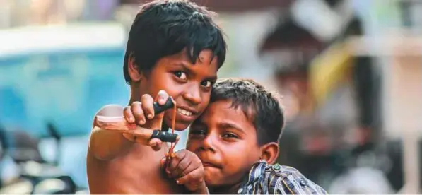  ??  ?? Jahir Hussain took this picture while on vacation in Chennai. He said: “You see a lot of children playing in the streets. They don’t need a luxurious lifestyle to be happy. They are happy with what they have.” More than 11 million children live on the streets of India, according to Unicef.