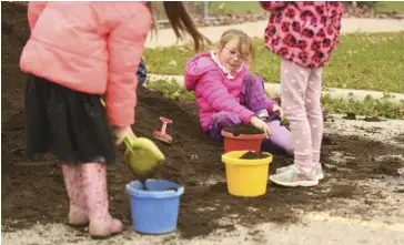  ?? File photo/Leah Gerber ?? Young students at Riverside PS helped plant trees at their school last fall.