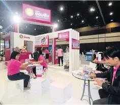  ?? SEKSAN ROJJANAMET­AKUN ?? The Government Savings Bank provides services to customers at a recent exhibition organised by ‘Post Today’ newspaper.