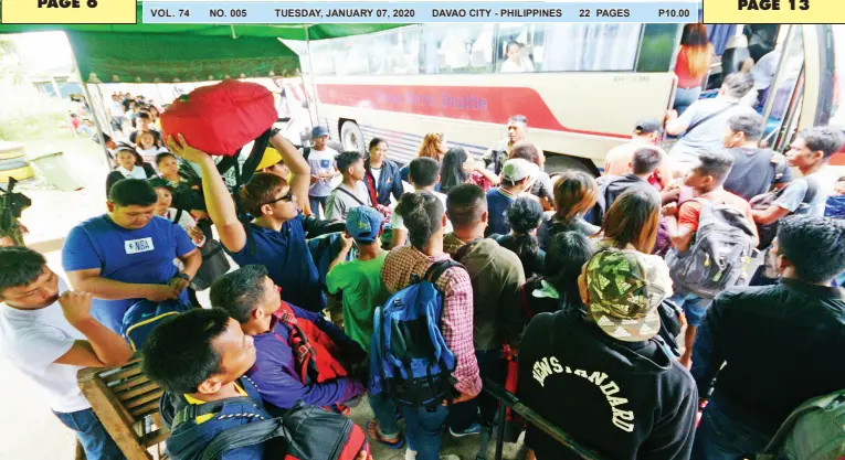  ?? BING GONZALES ?? THE CHECKPOINT of the Task Force Davao in Barangay Sirawan, Toril District is crowded by city-bound bus passengers coming from the southern provinces as the Christmas season ended with the Three Kings’ Day on Monday.