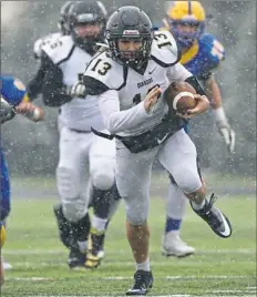  ?? Rebecca Droke/Post-Gazette ?? Quaker Valley quarterbac­k Ricky Guss was just as dangerous running the ball as he was throwing it.