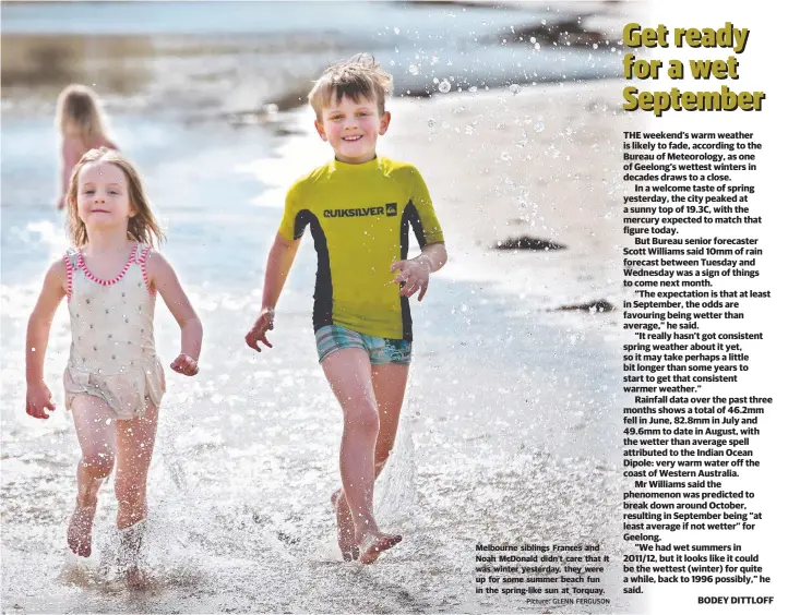  ?? Picture: GLENN FERGUSON ?? Melbourne siblings Frances and Noah McDonald didn’t care that it was winter yesterday, they were up for some summer beach fun in the spring-like sun at Torquay.