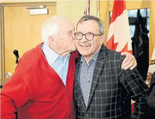  ?? RON PIETRONIRO/METROLAND ?? Mayor Steve Parish got a smooch from his dad and former mayor Bill Parish after the statement.