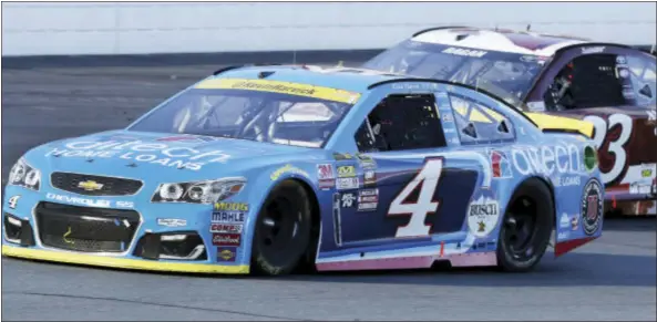  ?? JIM COLE — THE ASSOCIATED PRESS ?? Kevin Harvick (4) passes David Ragan (23) as he works his way to the front of the pack during the NASCAR Sprint Cup Series auto race at New Hampshire Motor Speedway, Sunday in Loudon, N.H.