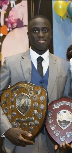  ??  ?? Arif Ogunseye with his awards for Irish and Academic Excellence and Graham King, 2018 Student of the Year.