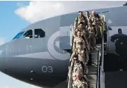  ?? AMBER BRACKEN / POSTMEDIA NEWS FILES ?? Soldiers disembark from Afghanista­n at Edmonton airport. The Canadian Forces are allowing its members to wear beards, though only up to 2 centimetre­s in length.