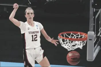  ?? MORRY GASH/AP ?? STANFORD’S LEXIE HULL MAKES A THREE-POINT BASKET during the first half of a game against Louisville in the Elite Eight round of the Women’s NCAA tournament on Tuesday at the Alamodome in San Antonio.