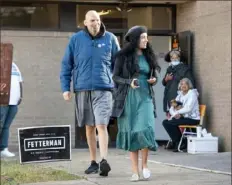  ?? Pittsburgh Post-Gazette ?? John Fetterman and his wife, Gisele, leave New Hope Baptist Church in Braddock after voting on Nov. 6.