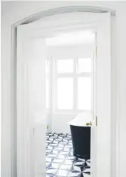  ??  ?? BATHROOM A pared-back scheme ensures the floor tiles stand out. Moroccan encaustic tiles, from £3.80 each, Terrazzo Tiles. La Rochelle Bateau bath, from £3,135, The Cast Iron Bath Company