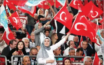  ?? — AFP photo ?? Supporters of Aksener hold Turkish  ags during an election campaign meeting in Ankara.