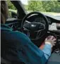  ?? NEW YORK TIMES 2019 THE ?? A driver uses GM’s Super Cruise mode, which can steer the car on its own.