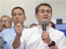  ?? — AFP ?? Honduran President Juan Orlando Hernandez delivers a press message in Tegucigalp­a.