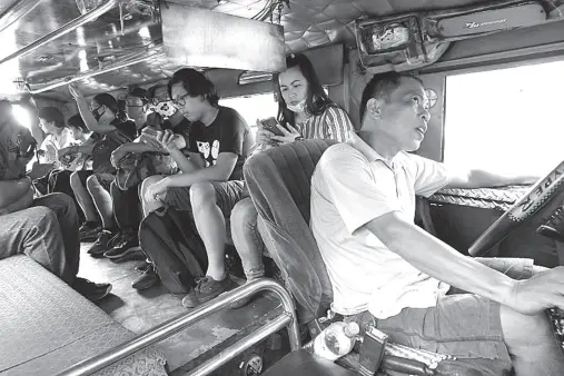  ??  ?? PASSENGERS of a jeepney plying the Cubao-Antipolo route still seem to be seating close with one another. As per a Department of Transporta­tion guideline, public transporta­tion commuters should at least observe the one-seat-apart policy or in this case a public utility jeep — they are only allowed to transport half of their seating capacity. This measure forms part of the community quarantine now being implemente­d in Metro Manila due to the coronaviru­s disease outbreak. PNA photo