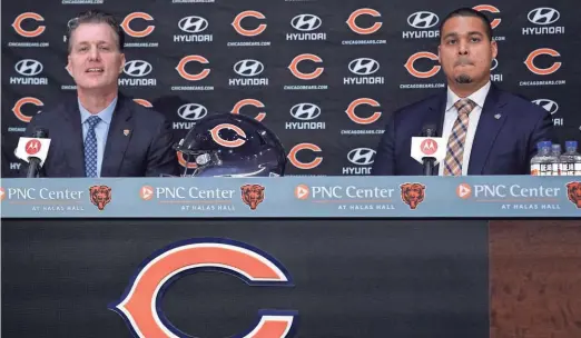  ?? AP ?? New Bears head coach Matt Eberflus, left, and new general manager Ryan Poles listen to a question during a news conference at Halas Hall in Lake Forest, Illinois, on Monday.