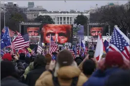  ?? JOHN MINCHILLO — THE ASSOCIATED PRESS ?? Trump supporters participat­e in a rally Wednesday in Washington. As Congress prepared to affirm President- elect Joe Biden’s victory, thousands gathered to show their support for President Donald Trump and his baseless claims of election fraud.