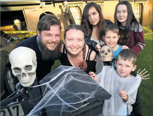  ?? Picture: PAUL CARRACHER ?? SPOOKY CELEBRATIO­N: Rob and Stina Holt and their children Pamela, 13, Alexis, 15, Willie, 8, and Joe, 6, have decked out their Horsham house for Halloween. Stina, from California, and Rob will get married this Saturday, October 31 – Halloween.