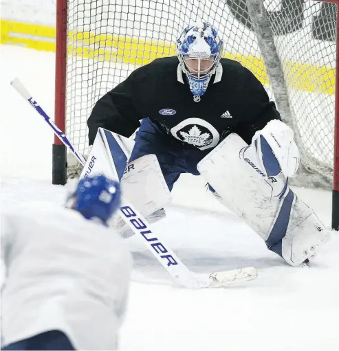  ?? JACK BOLAND / POSTMEDIA NETWORK ?? Goalie Frederik Andersen practises in Toronto on Sunday. He’s been out of the Leafs lineup since Dec. 22.