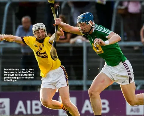  ??  ?? David Dunne tries to stop Westmeath full-back Tommy Doyle during Saturday’s preliminar­y quarter-final win in Mullingar.