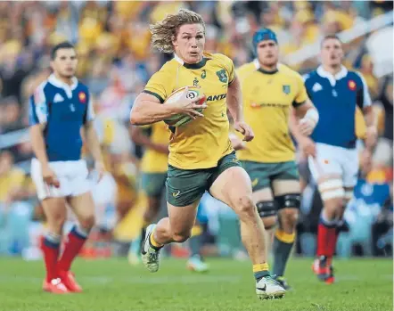  ?? Photo: Getty Images ?? Try time: Wallabies loose forward Michael Hooper breaks away to score for Australia yesterday.