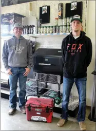  ?? MEGAN DAVIS/MCDONALD COUNTY PRESS ?? Mike Bratton and Chance Lemm are the friendly faces behind the counter at Longview Mill. The two are able to assist with questions about inventory, provide suggestion­s on merchandis­e and help load purchases.
