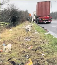  ??  ?? Volunteers collect about 3,000 pieces of litter every three weeks between the gyratory in Rawtenstal­l and the entry/exit roads of the A56