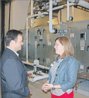  ?? JIM DAY/THE GUARDIAN ?? Terry Campbell, director of support services at the QEH, left, and Jamie MacDonald, the hospital’s chief administra­tive officer, chat near the large air handling unit for the ambulatory care centre.