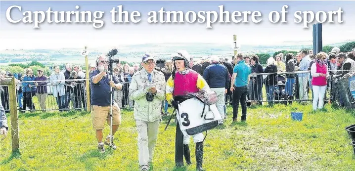  ?? John Beasley ?? > Brian Lee interviews James Bowen after he had won the men’s open race on Flying Eagle at Trecoed last year