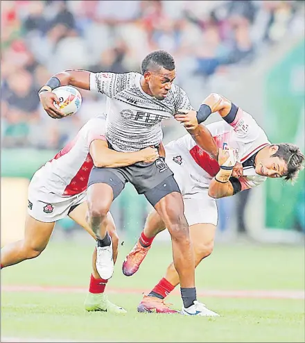  ?? Picture: TRY SPORT IMAGES ?? Isoa Tabu is stopped by the Japan defence during their match at the Cape Town 7s last weekend.