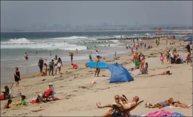  ?? NELVIN C. CEPEDA/SAN DIEGO UNION-TRIBUNE ?? Large crowds spent time at the beach in Imperial Beach for the 2018 Labor Day weekend.