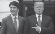  ?? SEAN KILPATRICK, THE CANADIAN PRESS ?? Prime Minister Justin Trudeau is greeted by U.S. President Donald Trump as he arrives at the White House on Wednesday.