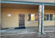  ?? COURTESY OF KEVIN MATTHEWS ?? A group vandalized The ACTS Center church at 75 Tennessee St. in Redlands by painting profanitie­s, racial slurs, upside-down crosses and other symbols on the building Thursday. Security camera footage showed seven people at the scene, police said.