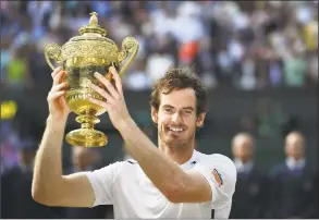  ?? GLYN KIRK / AFP / Getty Images ?? Andy Murray poses with the winner’s trophy after his men’s singles victory over Milos Raonic at the 2016 Wimbledon Championsh­ips.